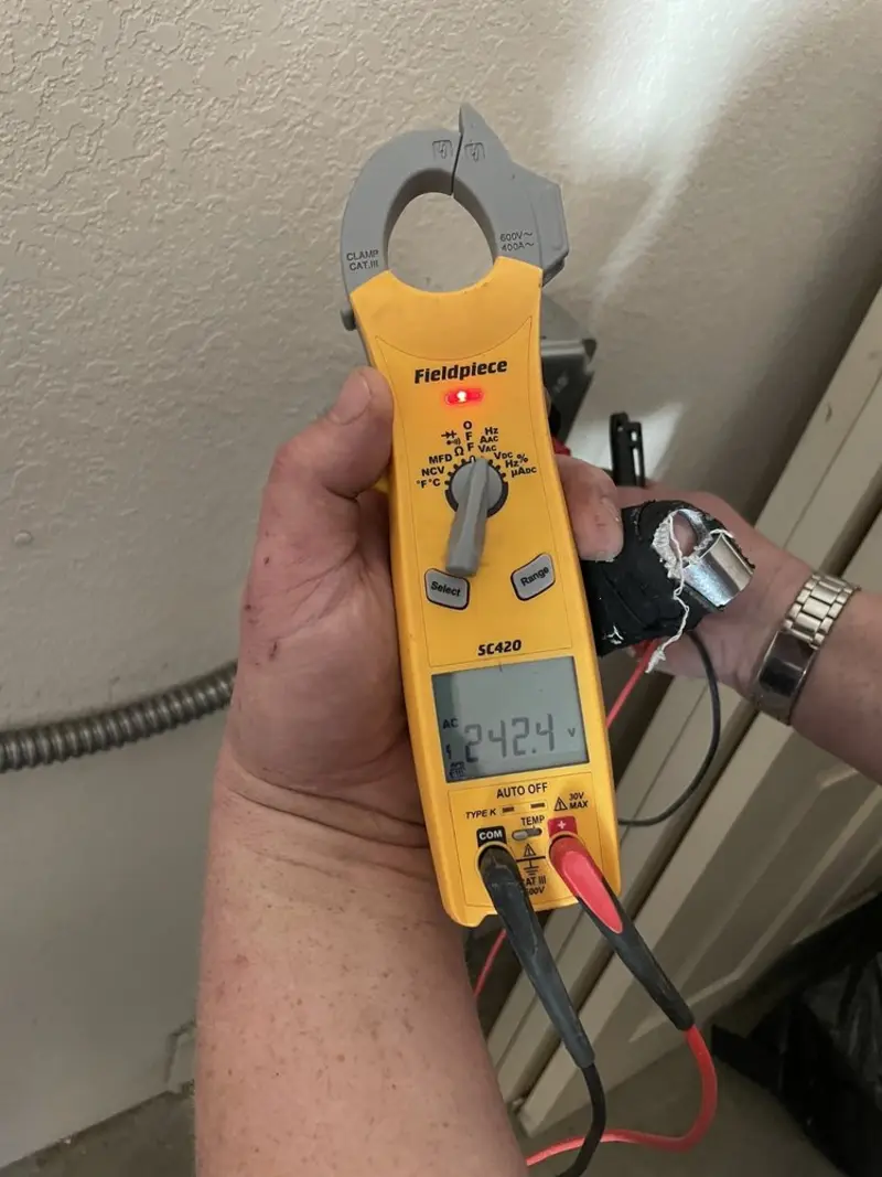 Voltage testing with clamp meter during Whole House Surge Protector in Perry Heights